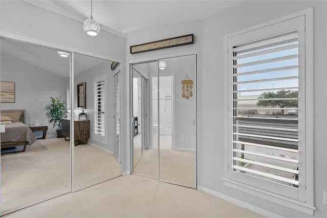 a view of a livingroom with furniture and windows