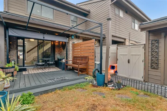 a view of the house with backyard and porch