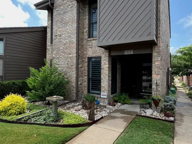 a front view of house with yard and seating space