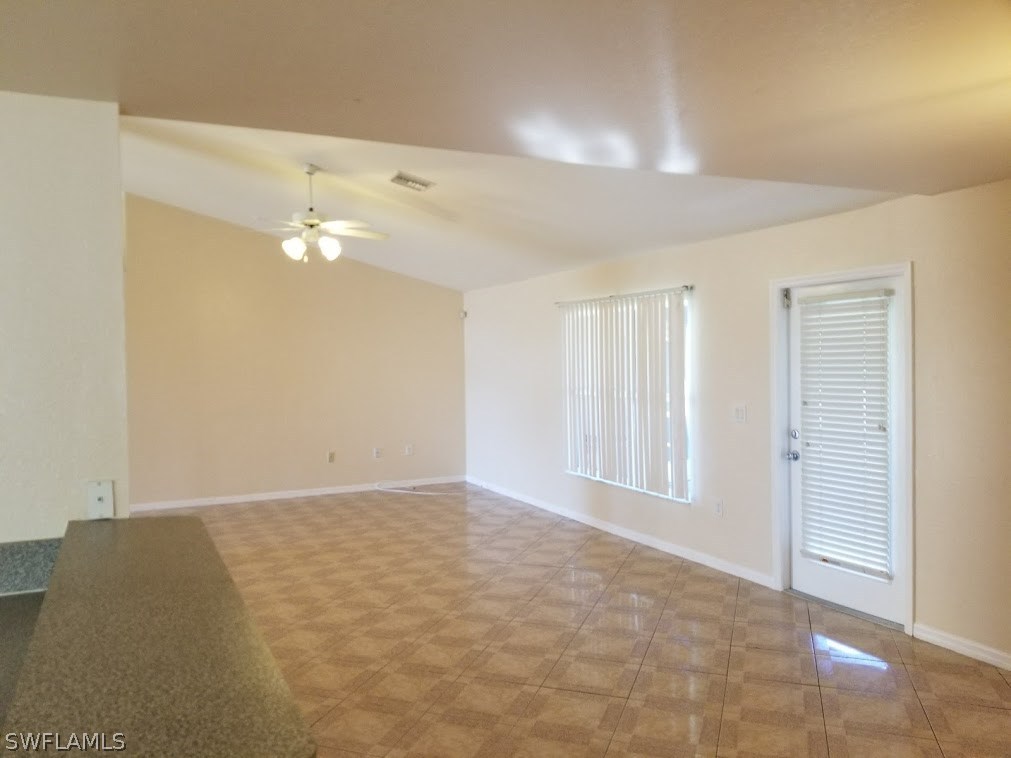 343 Ranch Avenue Lehigh Acres, FL 33974 - Photo 3 of 23 an empty room with windows