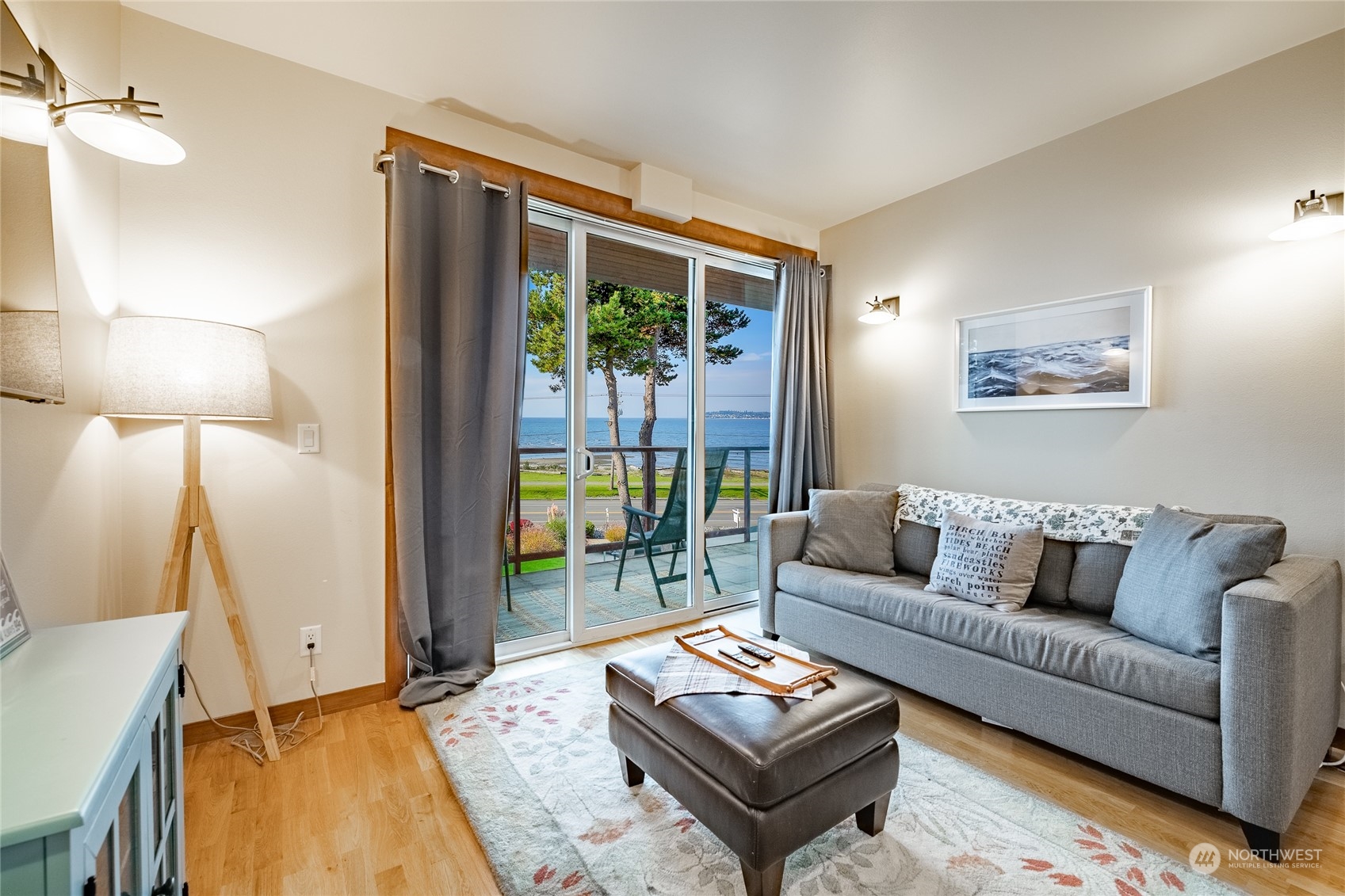 7714 Birch Bay Drive, Unit 203 Blaine, WA 98230 - Photo 12 of 25 a living room with furniture and a lamp