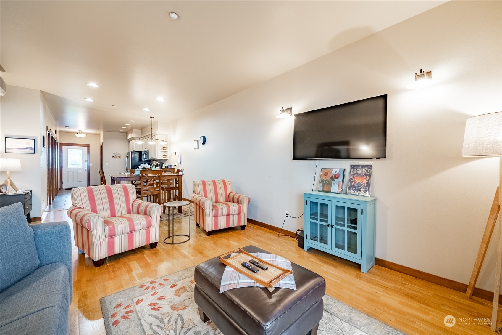 7714 Birch Bay Drive, Unit 203 Blaine, WA 98230 - Photo 14 of 25 a living room with furniture and a flat screen tv