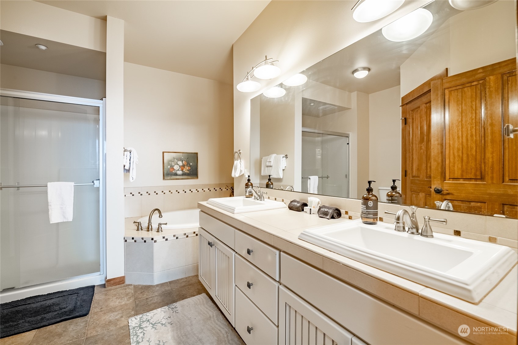 7714 Birch Bay Drive, Unit 203 Blaine, WA 98230 - Photo 17 of 25 a bathroom with a sink and a mirror