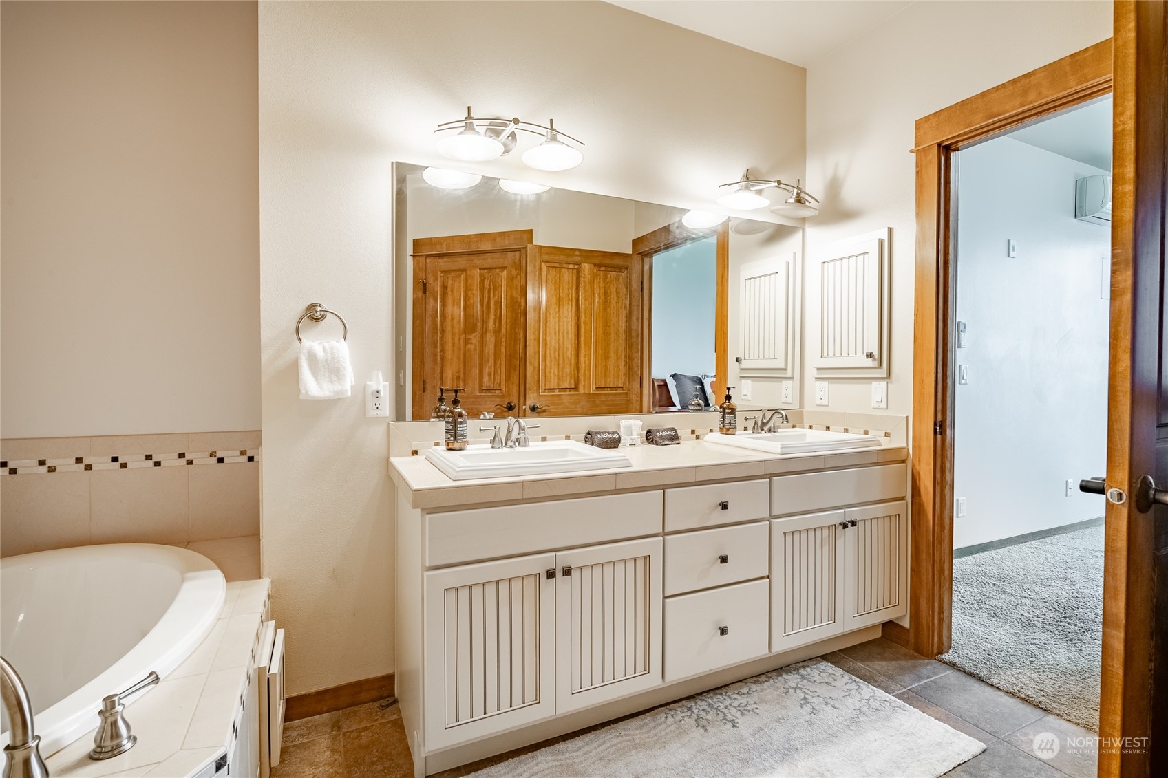 7714 Birch Bay Drive, Unit 203 Blaine, WA 98230 - Photo 18 of 25 a bathroom with a double vanity sink and a mirror