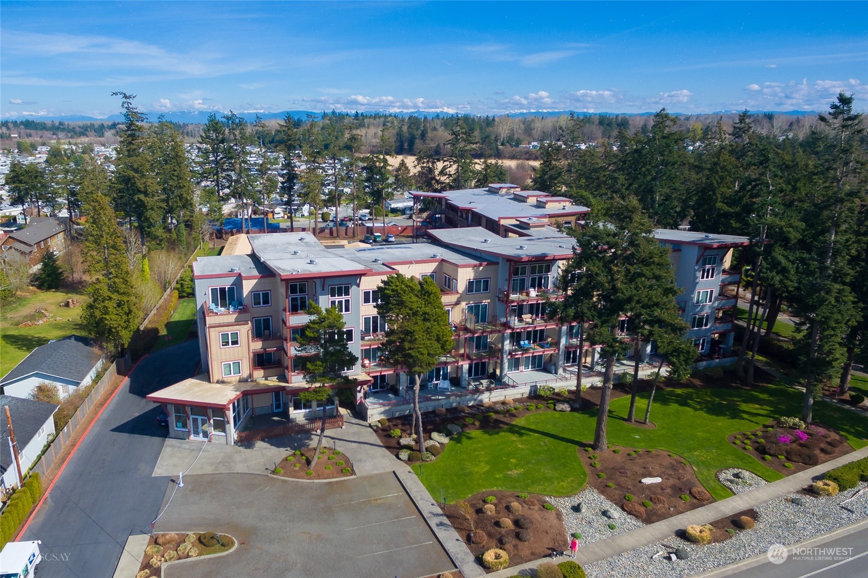 7714 Birch Bay Drive, Unit 203 Blaine, WA 98230 - Photo 23 of 25 an aerial view of a house with a garden and lake view