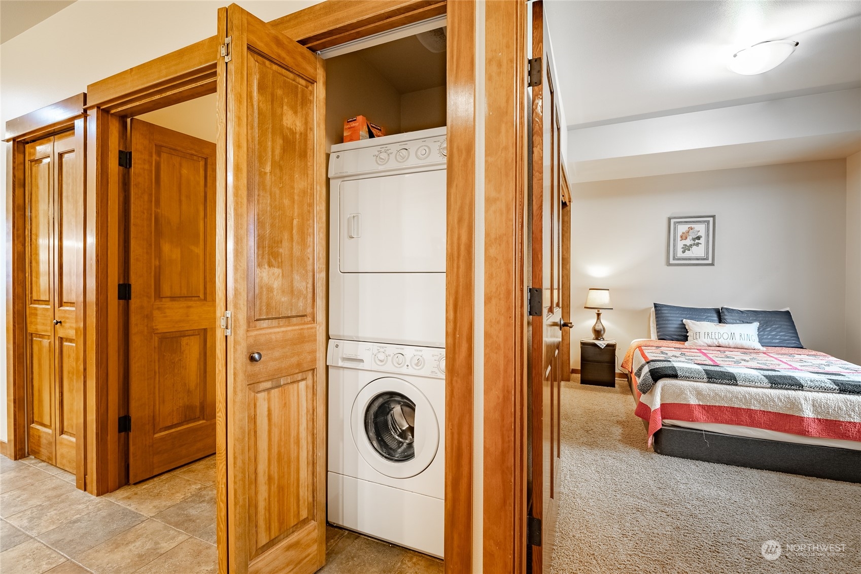 7714 Birch Bay Drive, Unit 203 Blaine, WA 98230 - Photo 7 of 25 a bedroom with a bed and a closet