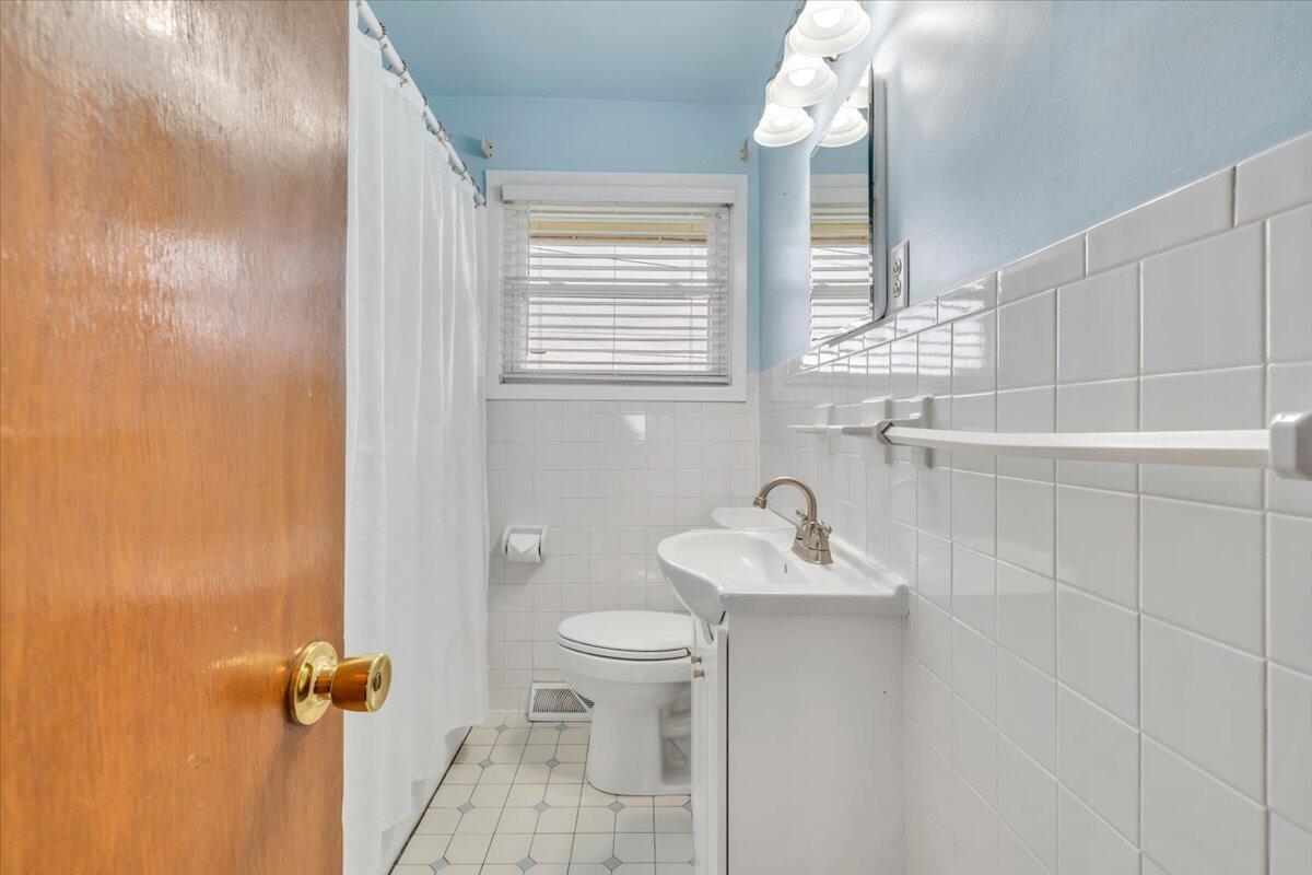 5156 Hazelridge Road Northwest Roanoke, VA 24012 - Photo 13 of 30 a bathroom with a sink a toilet and shower