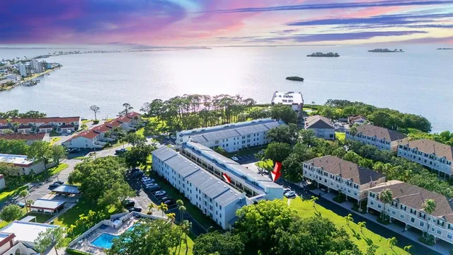 a view of a lake with a house in a background