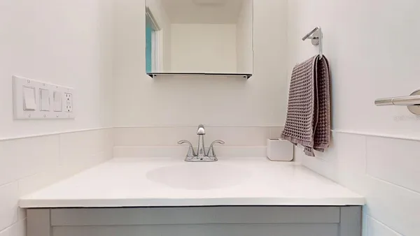 a backyard of a house with lots of green space table and chairs