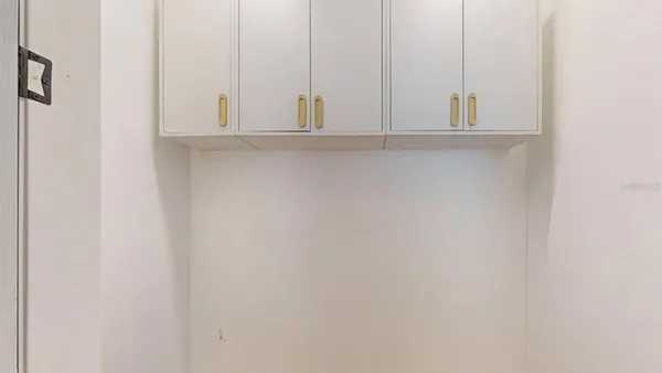 an aerial view of house with yard and ocean view