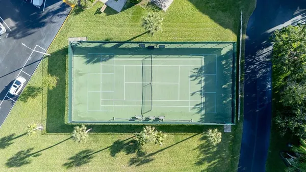 a car parked in front of a brick building