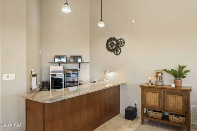 a bedroom with a bed and a balcony view