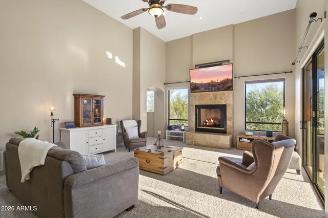 a view of a livingroom with furniture and a window