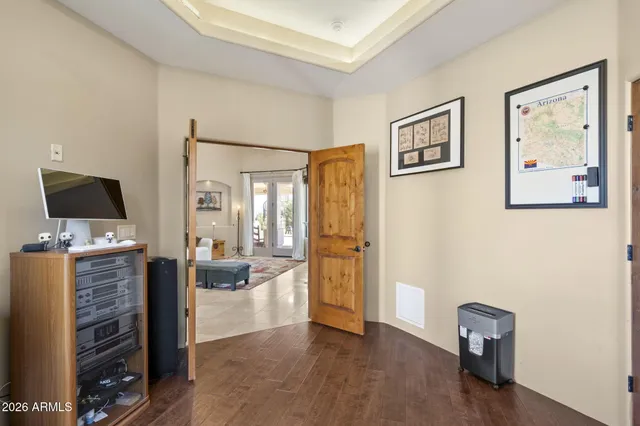 a living room with furniture large window and a fireplace