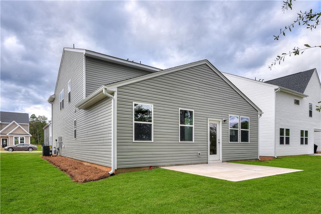 3280 Croftside Commons Powder Springs, GA 30127 - Photo 17 of 31 a front view of house with yard and green space