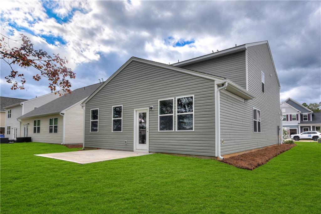 3280 Croftside Commons Powder Springs, GA 30127 - Photo 18 of 31 a front view of house with yard and green space