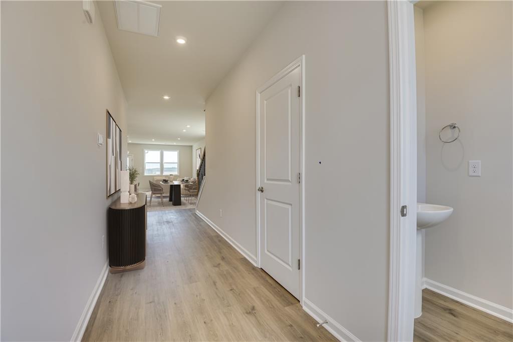 3280 Croftside Commons Powder Springs, GA 30127 - Photo 2 of 31 a view of a hallway with wooden floor and windows