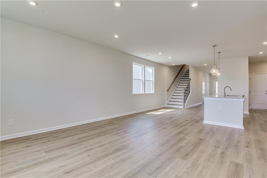 3280 Croftside Commons Powder Springs, GA 30127 - Photo 21 of 31 a view of an empty room with wooden floor and a window
