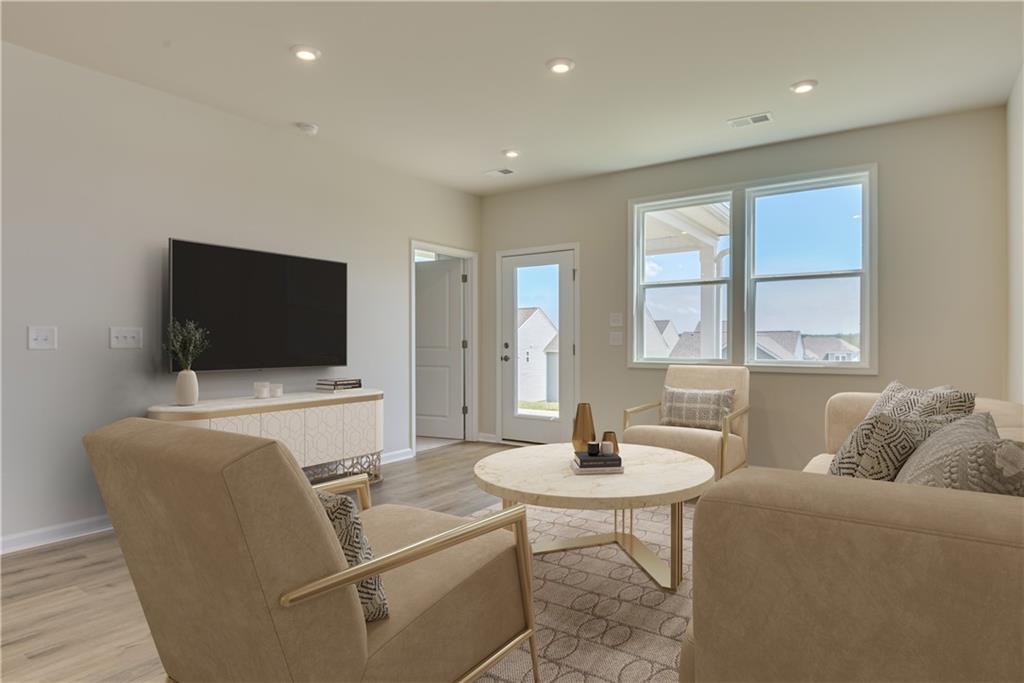 3280 Croftside Commons Powder Springs, GA 30127 - Photo 7 of 31 a living room with furniture and a flat screen tv