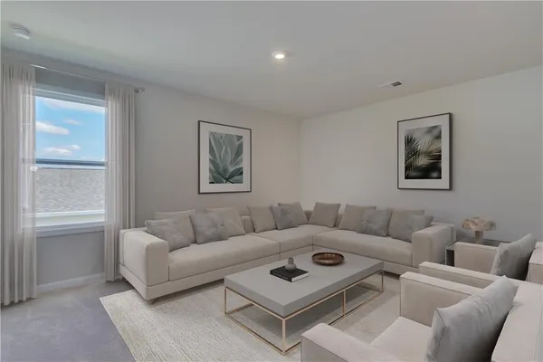 a living room with furniture and a window