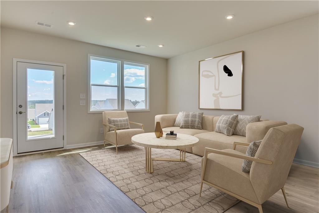 3280 Croftside Commons Powder Springs, GA 30127 - Photo 9 of 31 a living room with furniture and wooden floor