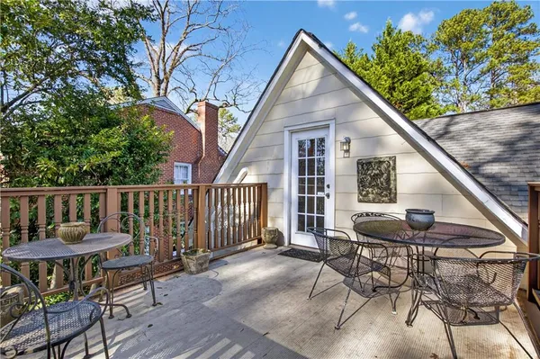 a view of a chairs and tables in the balcony