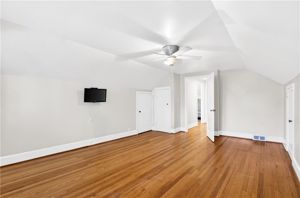 613 Pelham Road Northeast Atlanta, GA 30324 - Photo 12 of 24 a view of an empty room with wooden floor