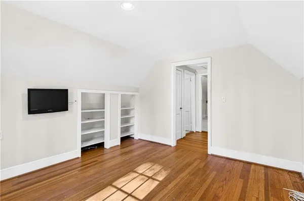 a view of a livingroom with wooden floor and closet
