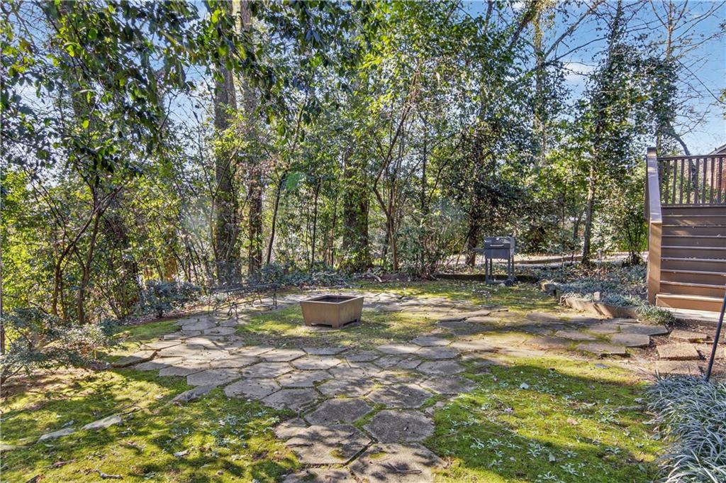 613 Pelham Road Northeast Atlanta, GA 30324 - Photo 20 of 24 a view of a backyard with large trees