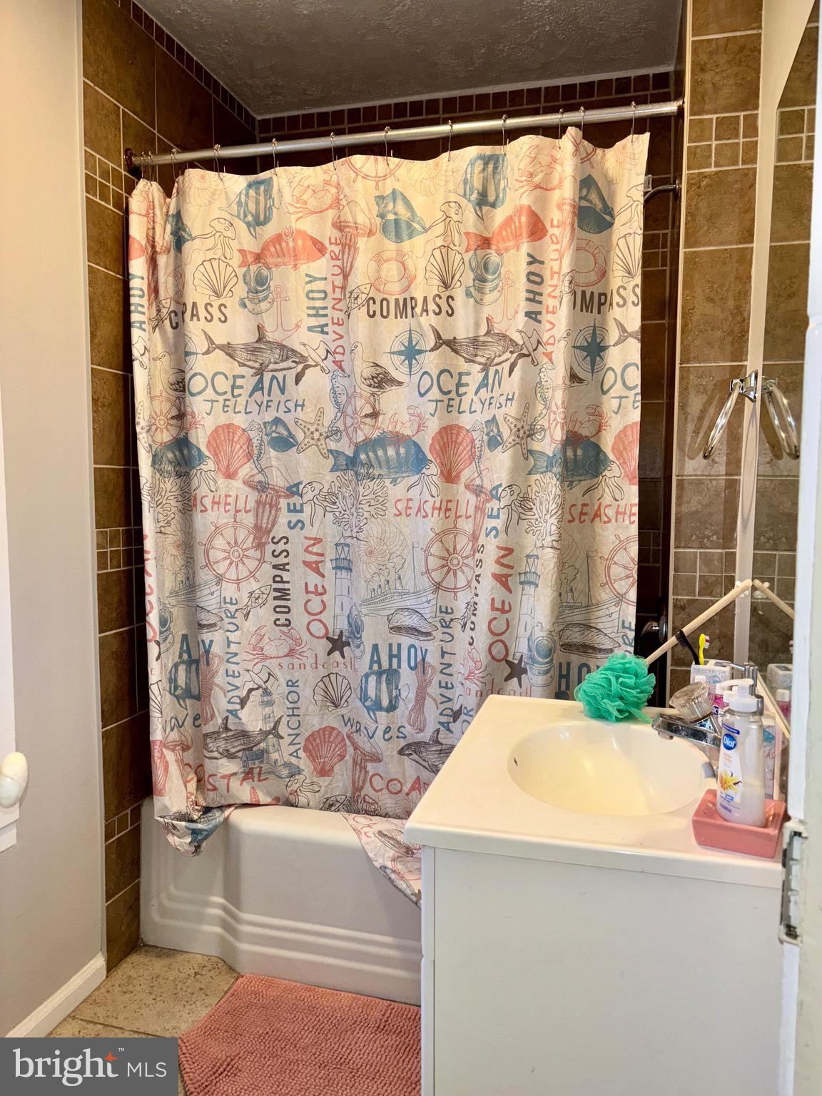179 Charles Road Lancaster, PA 17603 - Photo 13 of 29 a bathroom with a sink and a bathtub