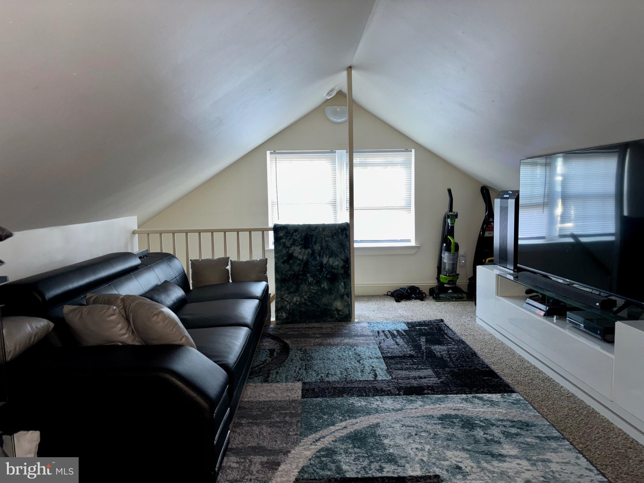 179 Charles Road Lancaster, PA 17603 - Photo 17 of 29 a living room with furniture and a flat screen tv