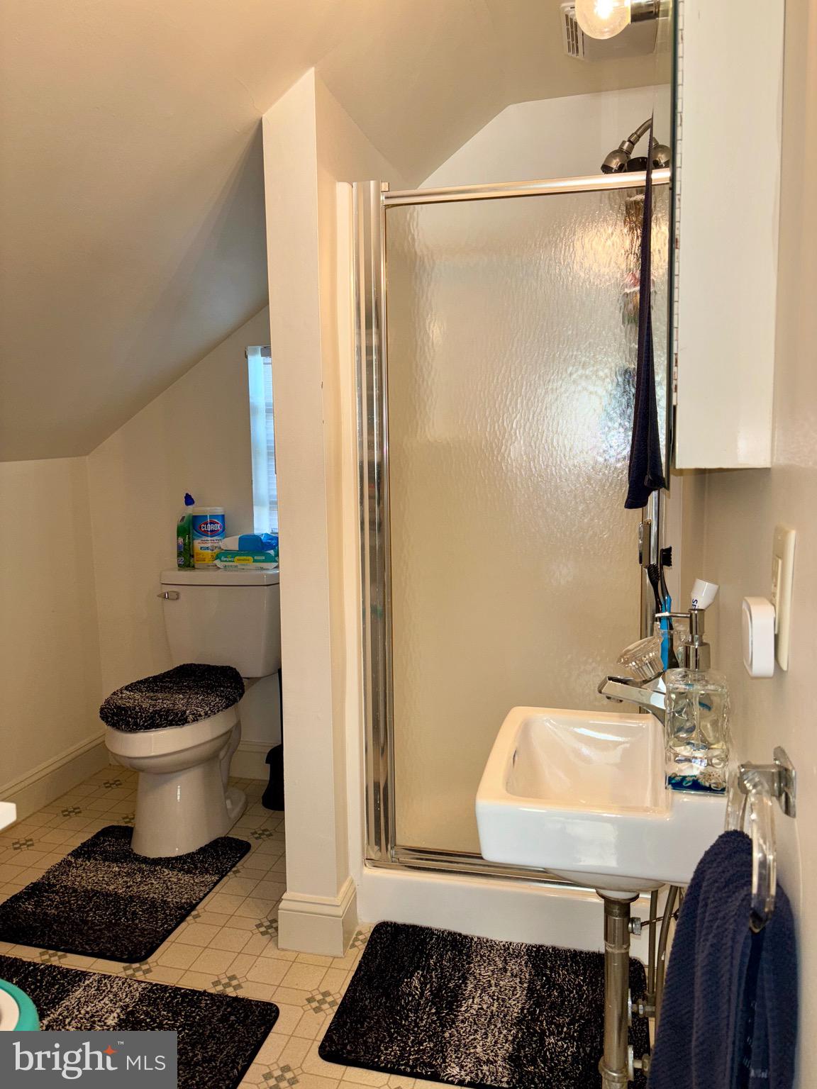 179 Charles Road Lancaster, PA 17603 - Photo 19 of 29 a bathroom with a sink a toilet and a mirror