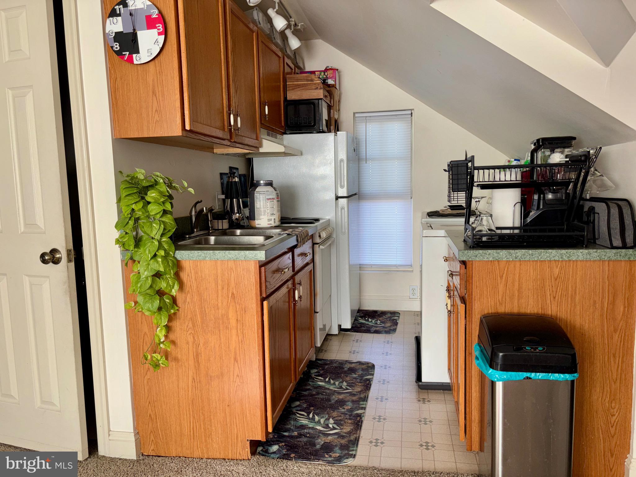 179 Charles Road Lancaster, PA 17603 - Photo 20 of 29 a kitchen with stainless steel appliances granite countertop a refrigerator a stove and a sink