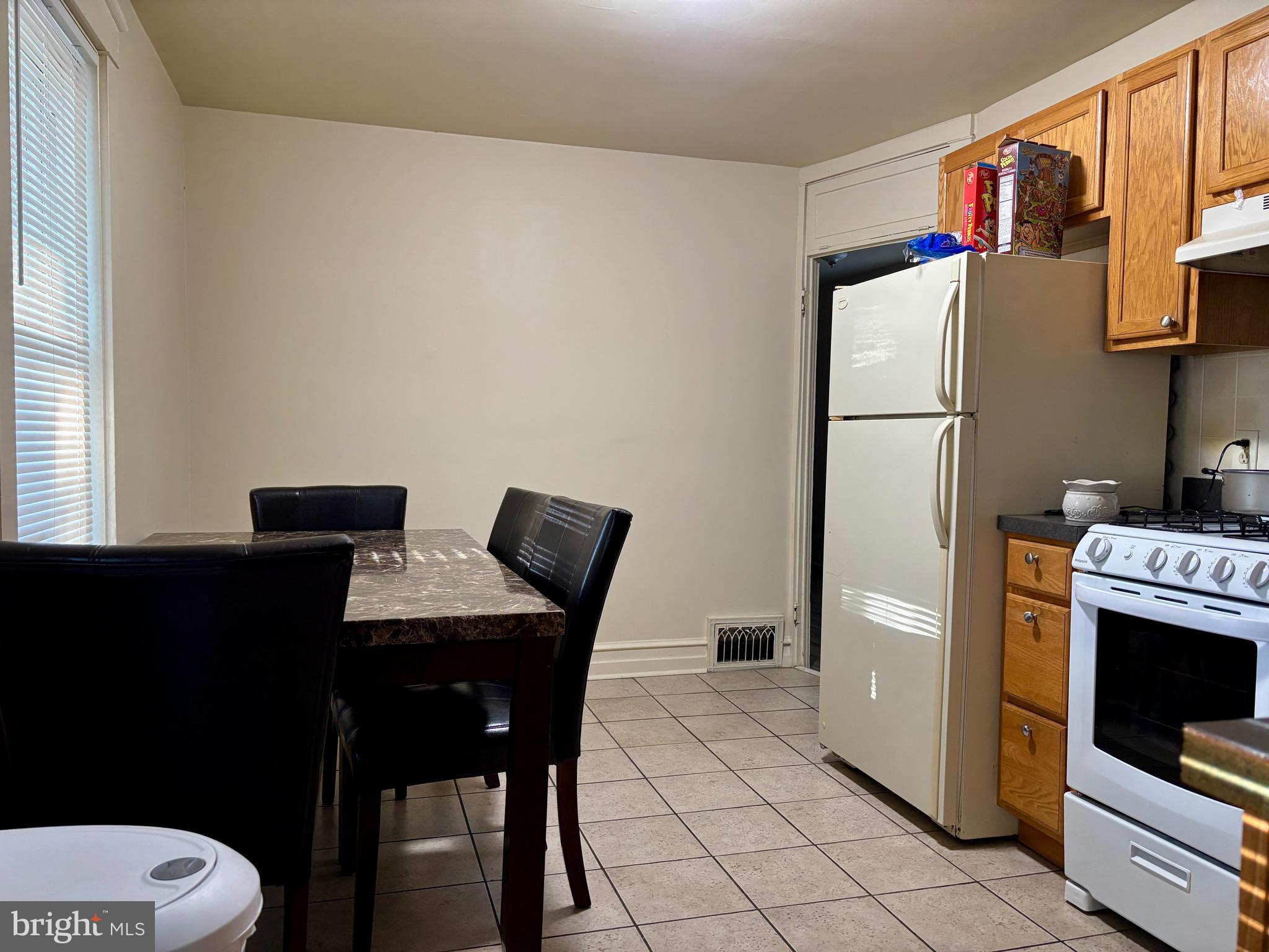 179 Charles Road Lancaster, PA 17603 - Photo 23 of 29 a kitchen with a refrigerator and a stove top oven