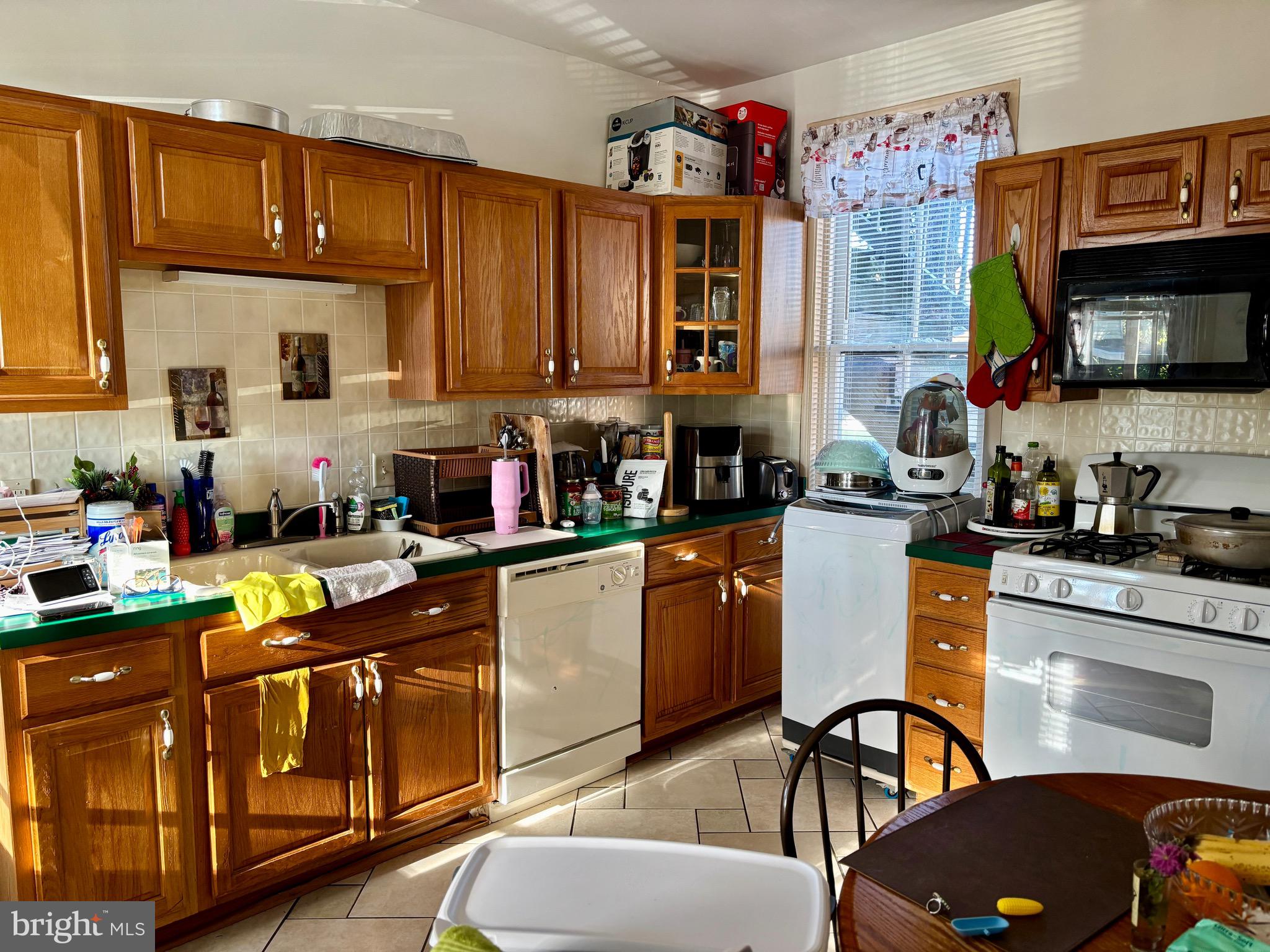 179 Charles Road Lancaster, PA 17603 - Photo 25 of 29 a kitchen with granite countertop lots of clutter and stainless steel appliances