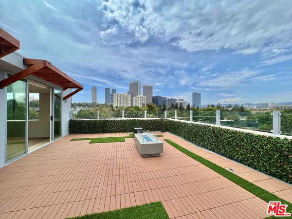 a view of swimming pool is middle in the garden