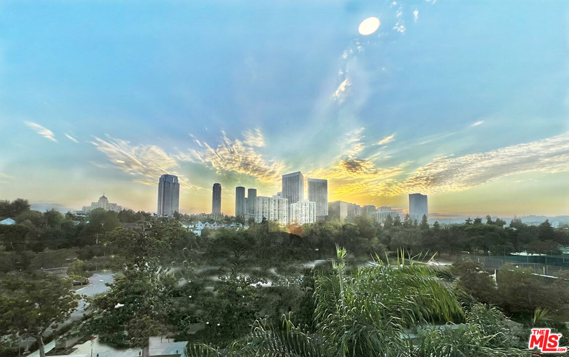 468 South Roxbury Drive, Unit PH Beverly Hills, CA 90212 - Photo 18 of 18 a front view of a house with a yard