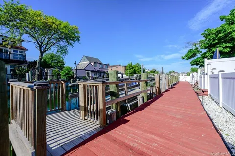 a view of a house with wooden deck