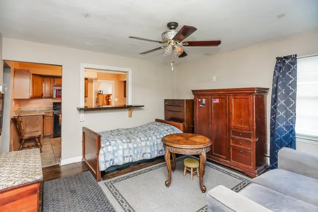 a living room with a couch and dresser