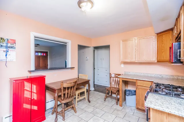 a kitchen that has a sink and chair