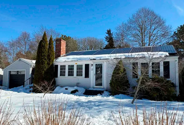 a view of a house with yard and sitting area