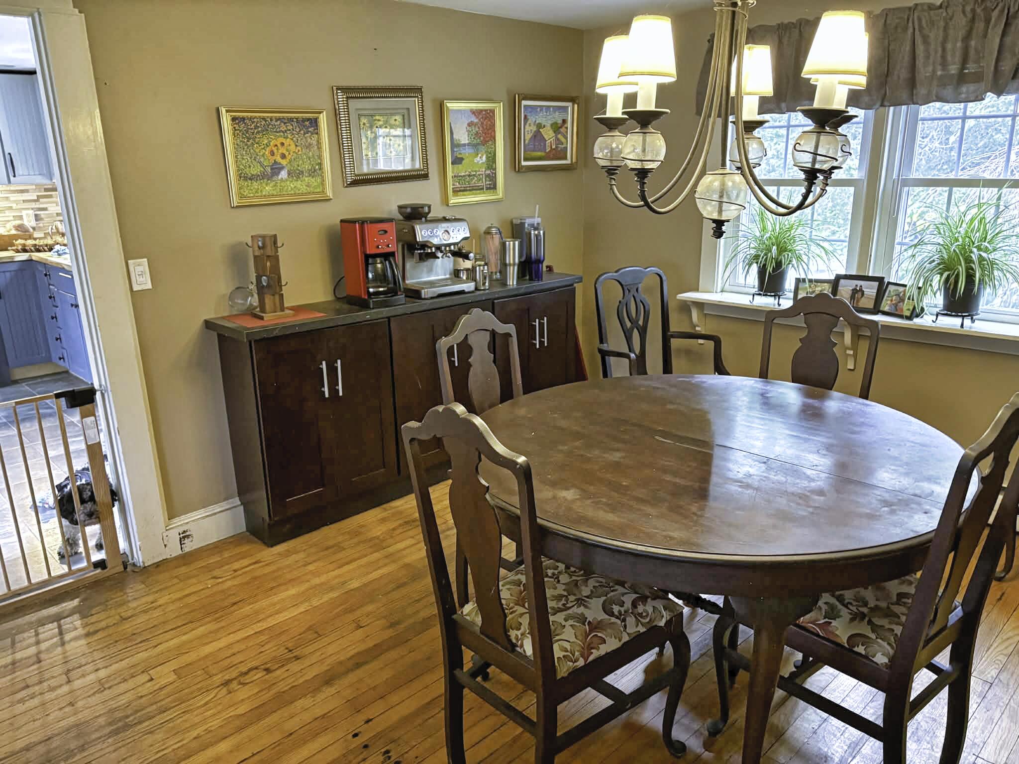 13 Allen Street Harwich, MA 02645 - Photo 11 of 31 a view of a dining room with furniture and a chandelier