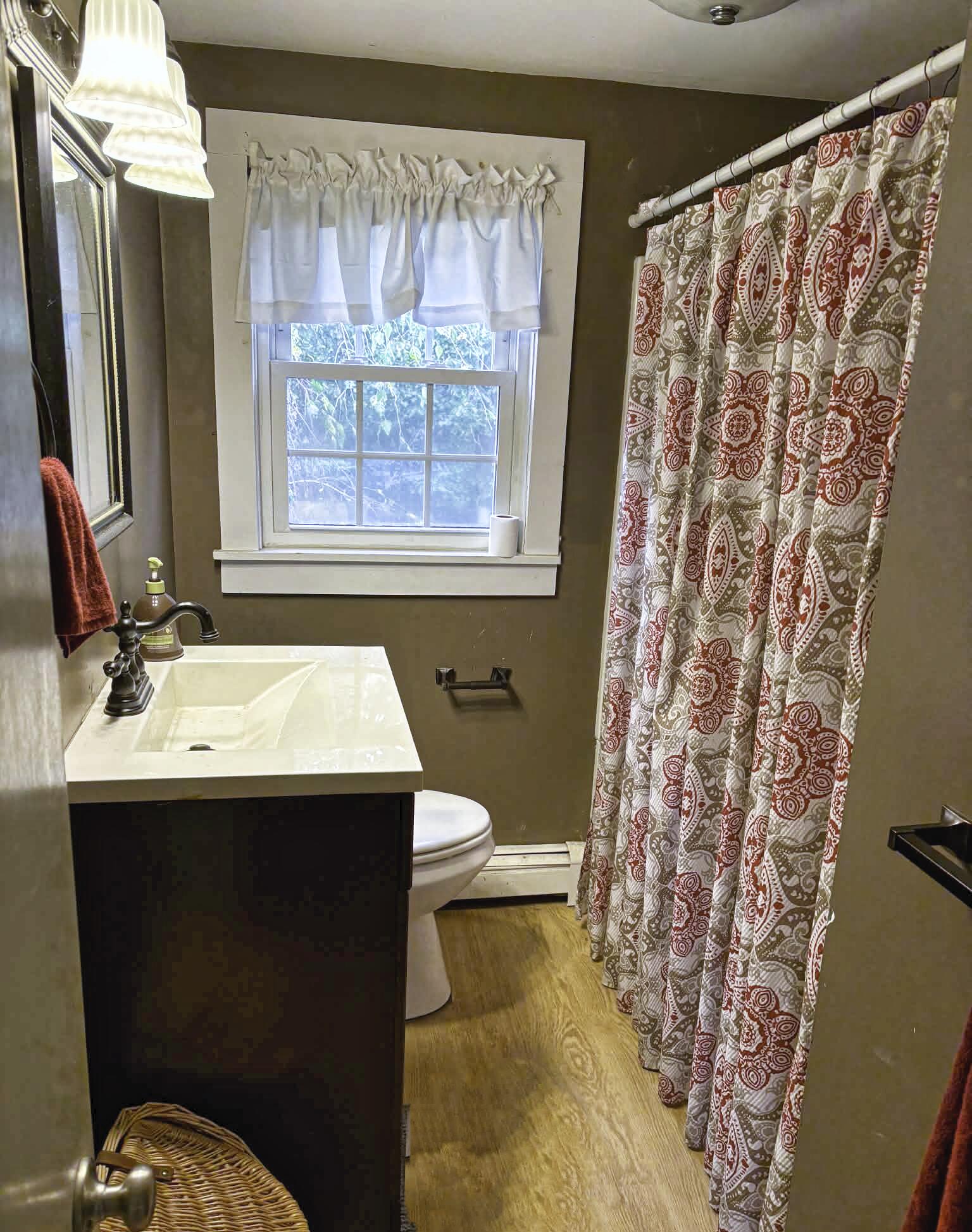 13 Allen Street Harwich, MA 02645 - Photo 19 of 31 a bathroom with a sink and mirror