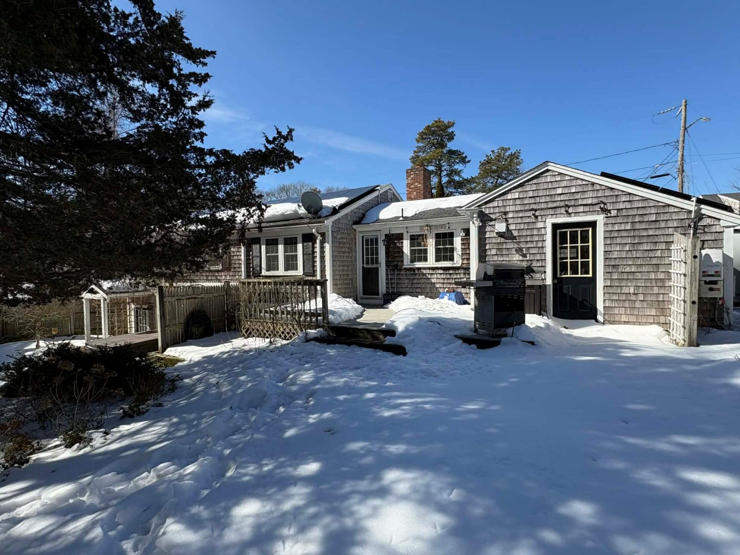 13 Allen Street Harwich, MA 02645 - Photo 2 of 31 a front view of a house with a yard