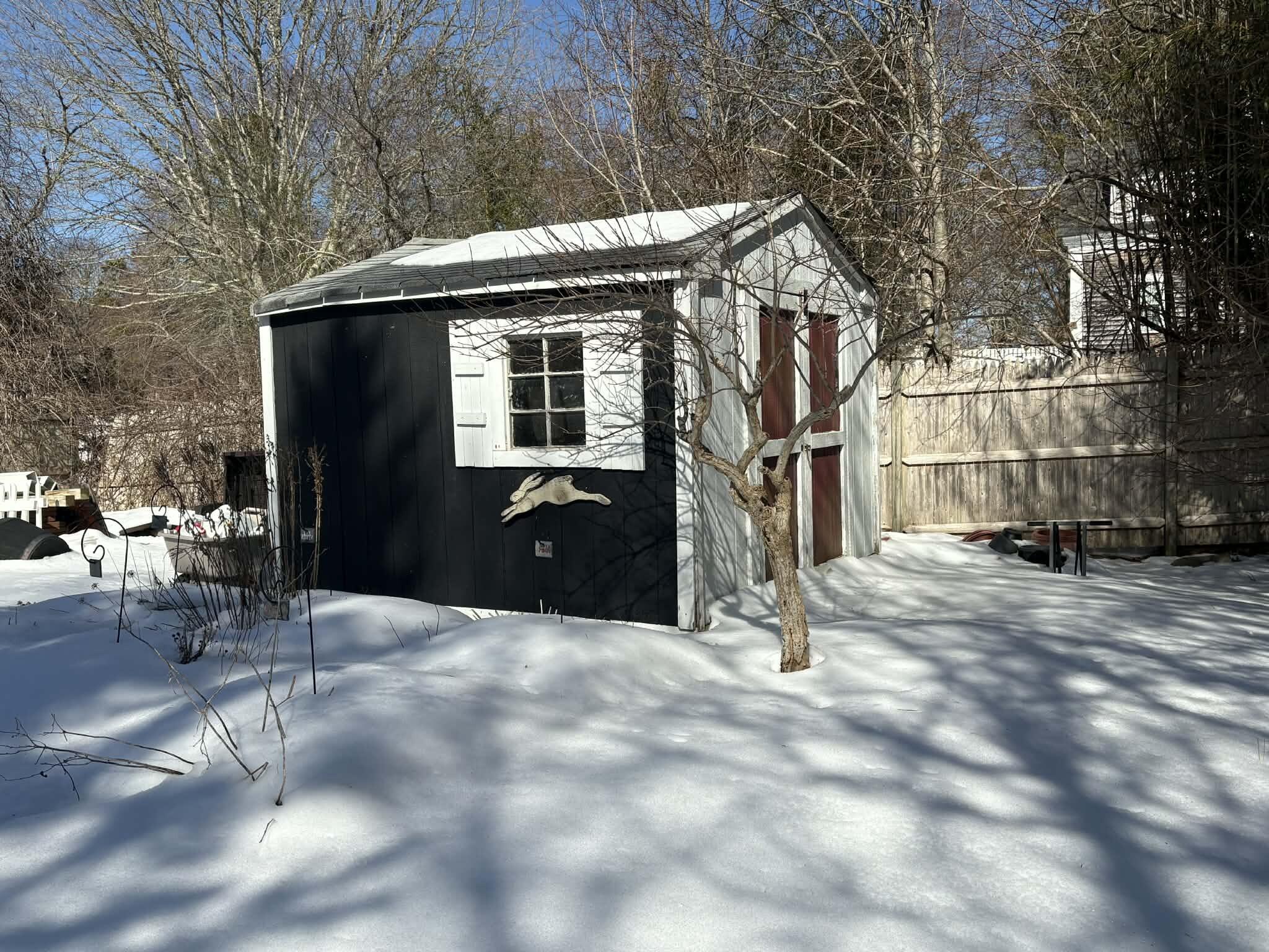 13 Allen Street Harwich, MA 02645 - Photo 27 of 31 a backyard of a house with barbeque oven and trees