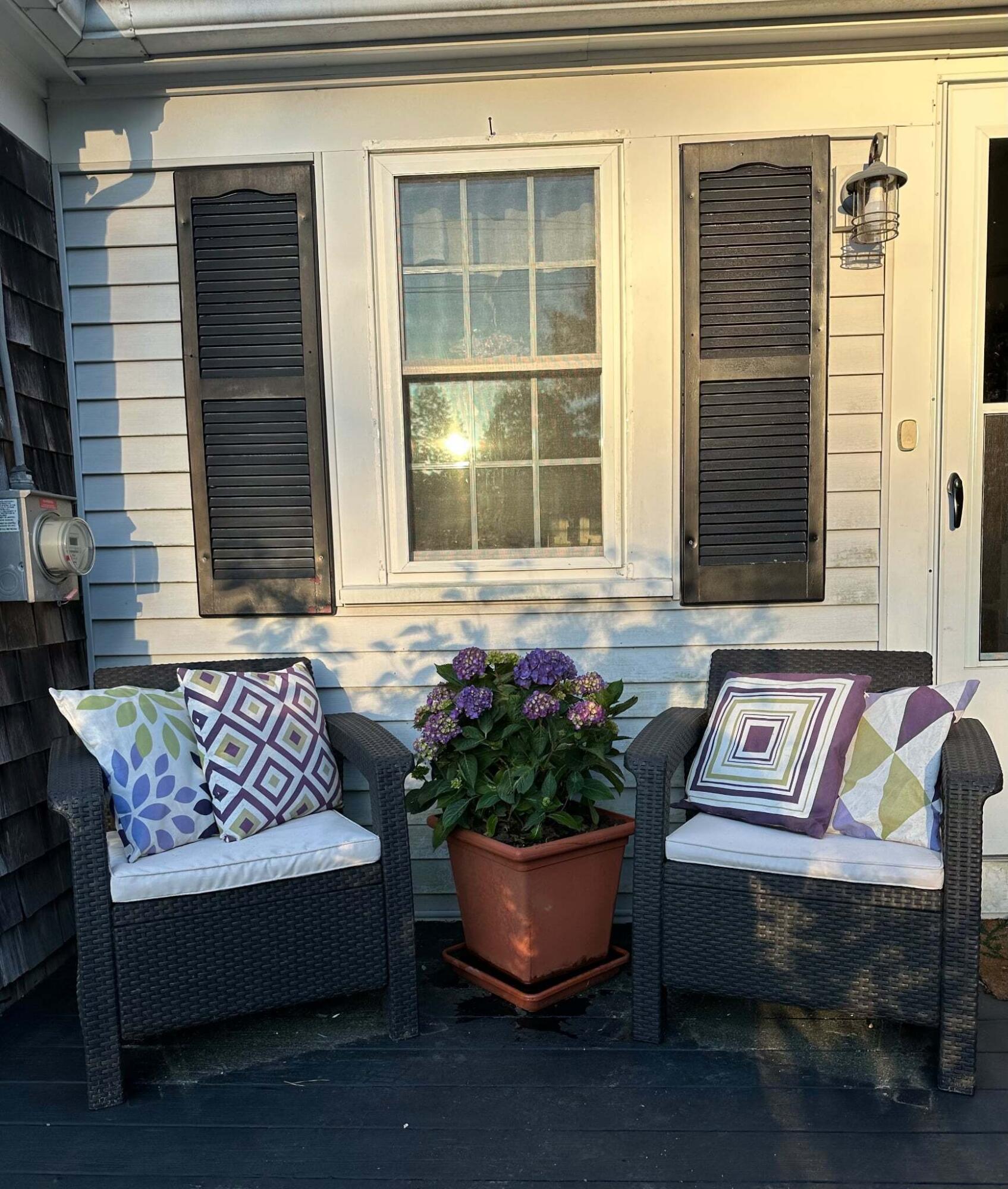 13 Allen Street Harwich, MA 02645 - Photo 8 of 31 a front view of a house with outdoor seating