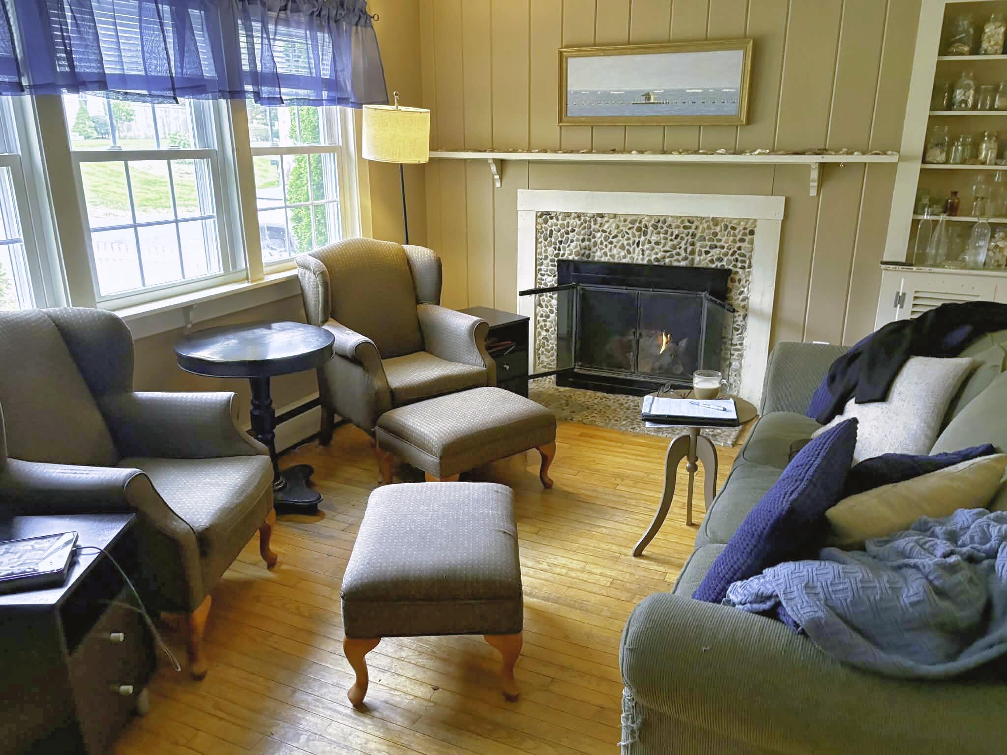 13 Allen Street Harwich, MA 02645 - Photo 9 of 31 a living room with furniture and a fireplace
