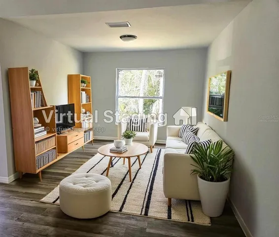 a living room with furniture and a window