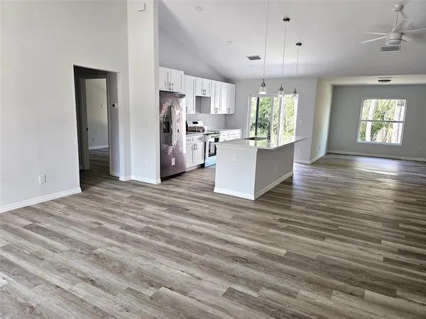 a view of kitchen and windows