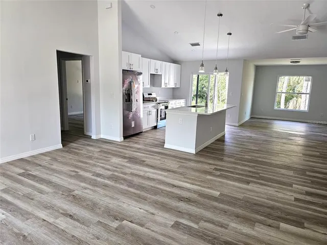 a view of kitchen and windows